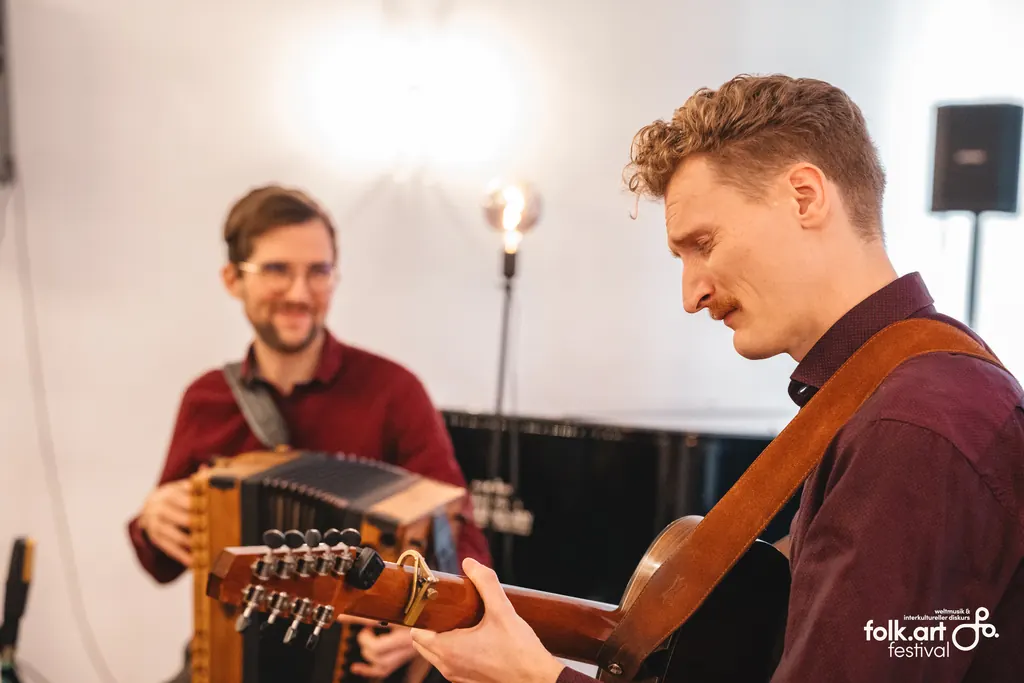 Jonny and Timmy playing on stage at folkArt Festival Graz